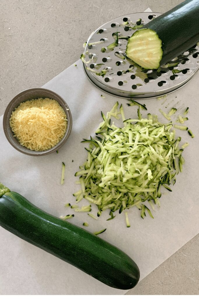 Squeezing out the excess water from the zucchini is very important as it means your sourdough zucchini fritters won't be watery.