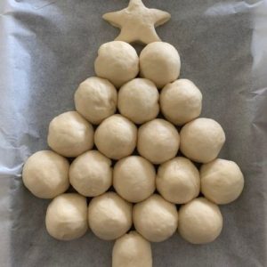 Creating Christmas Tree shape with sourdough rolls.