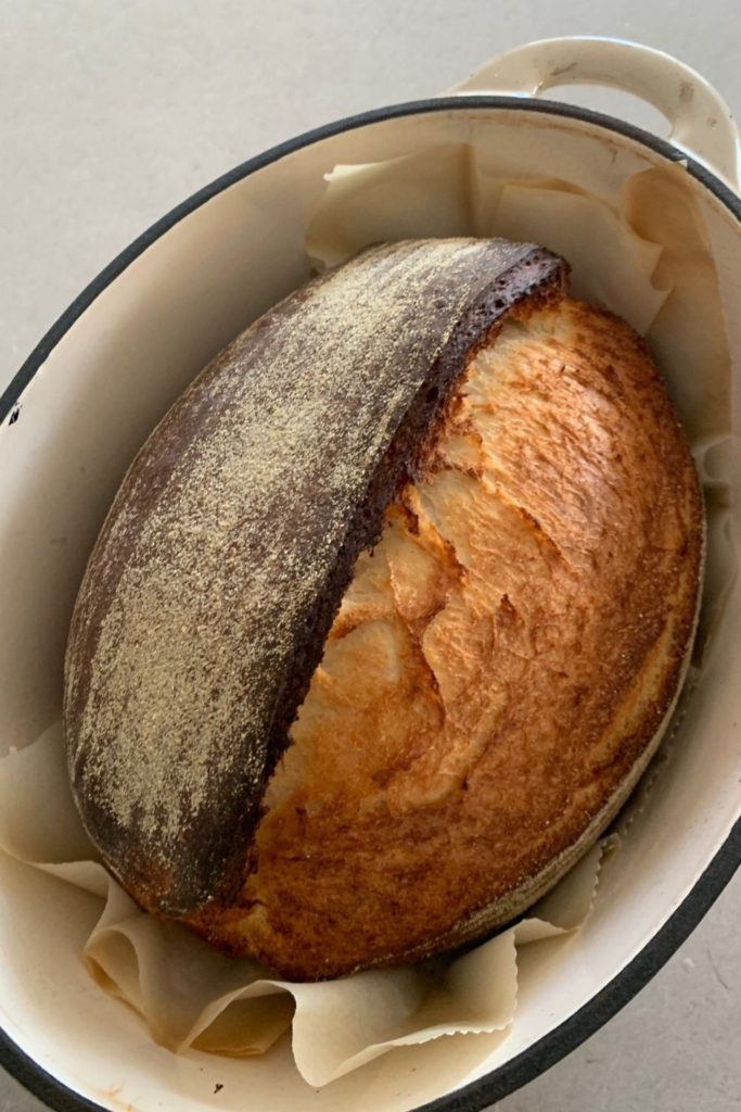 Sourdough Pane Di Casa Recipe - photo shows a loaf of sourdough pane di casa baked in a cast iron pot