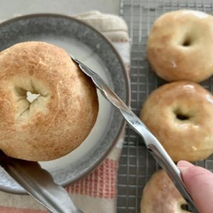 Dip baked donuts into powdered sugar glaze.