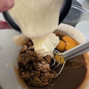 Adding sourdough starter to chocolate and butter mixture
